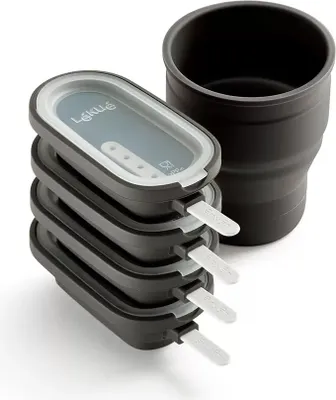 A set of four ice pop molds stacked together, with a black holder next to them, on a white background.