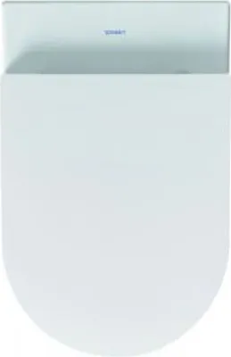 A top-down view of a white toilet seat.