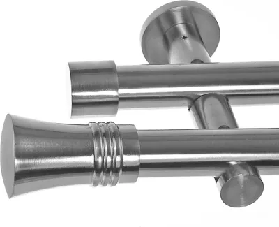 Close-up view of a double curtain rod system with mounting hardware.