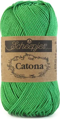A ball of green yarn with a brown paper label.