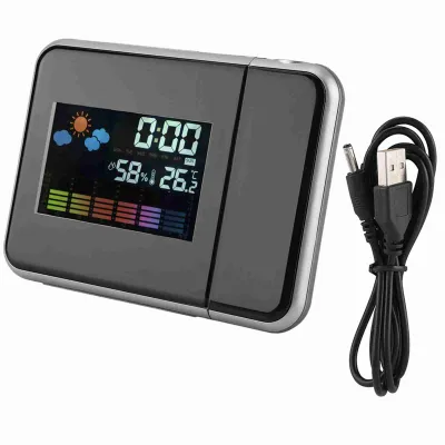 A digital alarm clock with weather display and a USB cable on a white background.