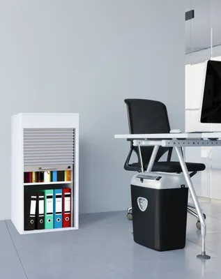An office setting with a filing cabinet and a desk.