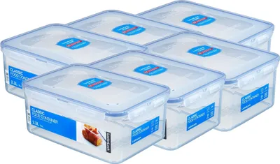 A set of clear plastic food storage containers with blue lids, arranged diagonally on a white background.