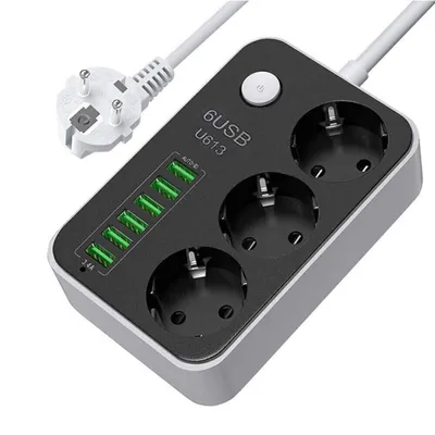 A power strip with multiple outlets and USB ports, shown from a diagonal angle on a white background.