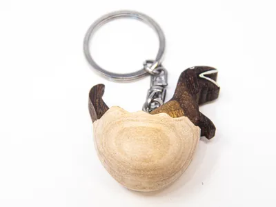 Produktbild von Schlüsselanhänger aus Holz - T-Rex im Ei