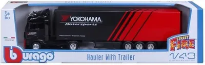 A toy truck and trailer in its retail packaging.