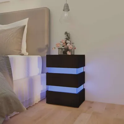 A bedroom scene with a nightstand next to a bed.
