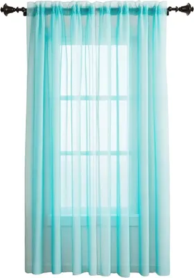 A sheer turquoise curtain hangs in front of a window.