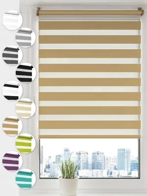 A close-up view of a beige and white striped roller blind hanging in a window, with a city skyline visible outside.
