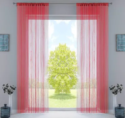 A room with a large window covered by red string curtains, with a tree visible outside.