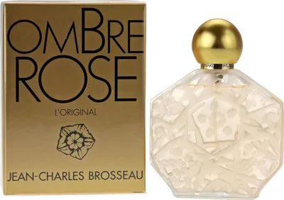 Ombre Rose L'Original von Jean-Charles Brosseau: florales Parfum in edlem, graviertem Glasflakon mit goldener Kappe, daneben passende goldene Verpackung.