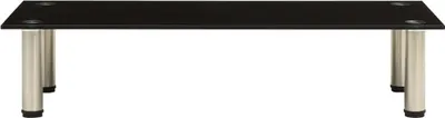 A black glass TV stand with silver legs on a white background.