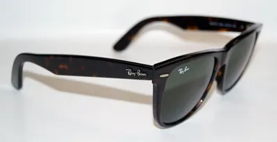 A close-up, side view of a pair of Ray-Ban Wayfarer sunglasses on a white background.