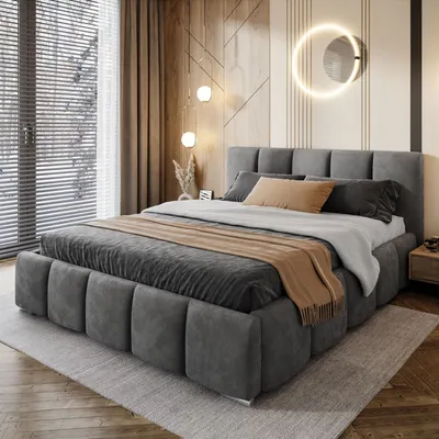 A bedroom scene with a bed, window, and wall decor.
