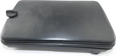 A black plastic air filter cover for a generator.