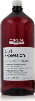 A bottle of L'Oréal Professionnel Curl Expression shampoo.