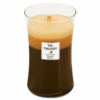 A three-layered scented candle in a glass jar.