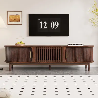 A living room scene featuring a TV stand and a television.