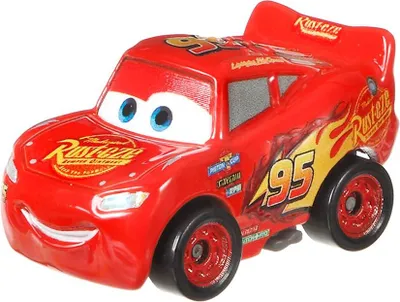 A close-up, front-facing view of a red toy car, Lightning McQueen from the movie Cars, on a white background.