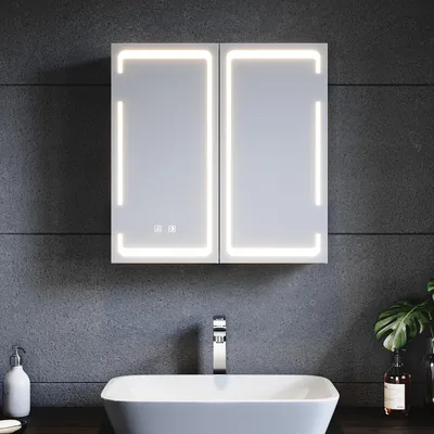 A modern bathroom vanity with a medicine cabinet and sink.
