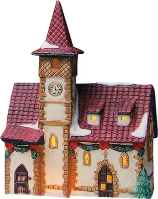 A ceramic Christmas village church with a clock tower, decorated with snow and garlands.