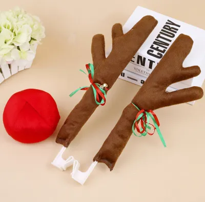 A set of reindeer antlers and a red nose accessory for a car, likely for Christmas decoration.