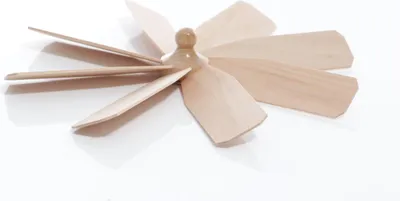 A wooden pyramid accessory with multiple blades arranged in a radial pattern, set against a white background.