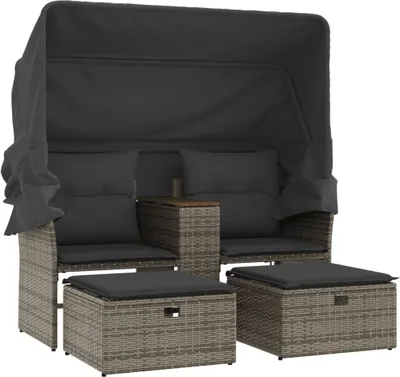A garden sofa with a canopy and two ottomans, all made of grey poly rattan with dark grey cushions.