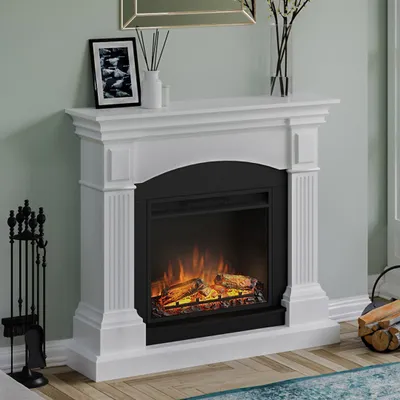 A white electric fireplace with a black insert and glowing logs, set against a light green wall and a wooden floor.