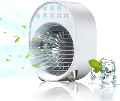 A portable mini air cooler with ice cubes and mint leaves to emphasize its cooling effect.