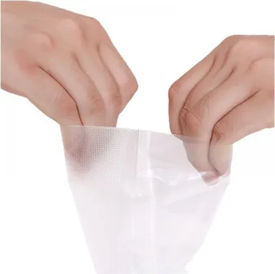 Hands are shown opening a vacuum seal bag.