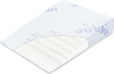 A wedge-shaped pillow with a patterned cover.