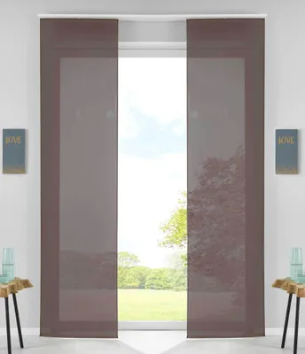 Two brown panel curtains are shown hanging in front of a window with a view of trees and a grassy field.