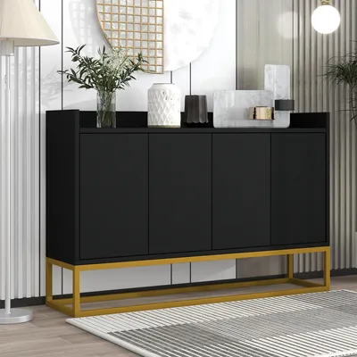 A black sideboard with a gold metal frame, decorated with various vases and decorative objects on top, placed in a room with a striped wall and a patterned rug.