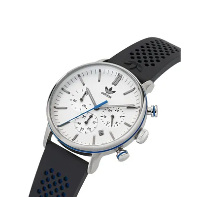 A close-up, angled shot of an Adidas chronograph watch against a white background.