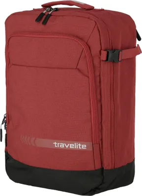 A red Travelite backpack is shown against a white background.