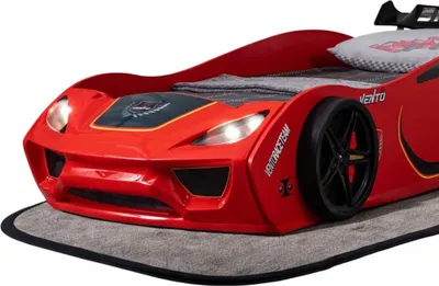 A red race car-shaped children's bed is shown from the front-left angle.