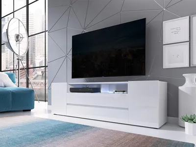 A modern living room with a TV stand, TV, sofa, and floor lamp.