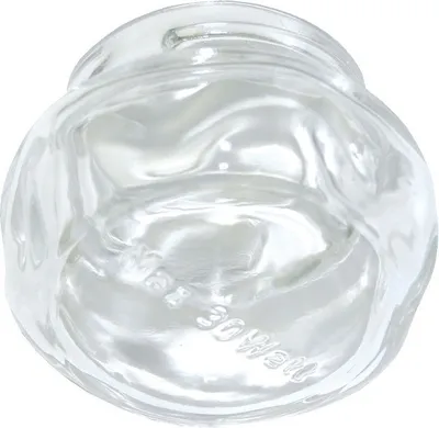 A clear glass lamp cover for an appliance.