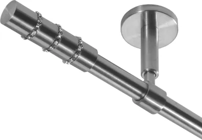 A close-up view of a metal curtain rod with decorative crystals and a ceiling mount.
