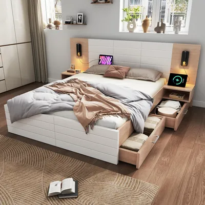 A bedroom scene featuring a modern bed with integrated nightstands and storage drawers, illuminated by wall-mounted lights.