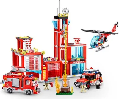 A Lego-style fire station playset with vehicles and a helicopter.