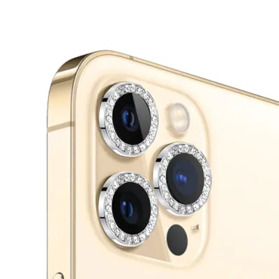 Close-up of the camera lenses of a smartphone, with decorative rings around them.
