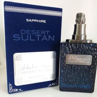 A perfume bottle and its box are displayed on a white background.