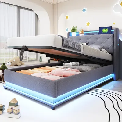 A bedroom setting with a bed that has its storage compartment open.