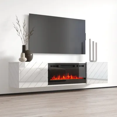 A modern white TV lowboard with a black electric fireplace is mounted on a white wall.