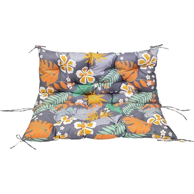 A colorful cushion with a tropical leaf and flower pattern, shown flat against a white background.