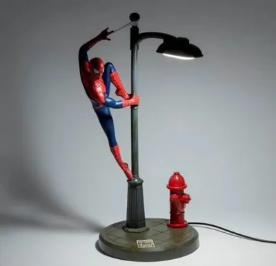 A Spiderman lamp with a fire hydrant base.