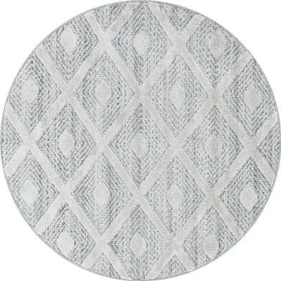 A circular rug with a diamond pattern.