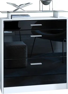 A modern white and black dresser with a glass shelf on top, displaying decorative items.